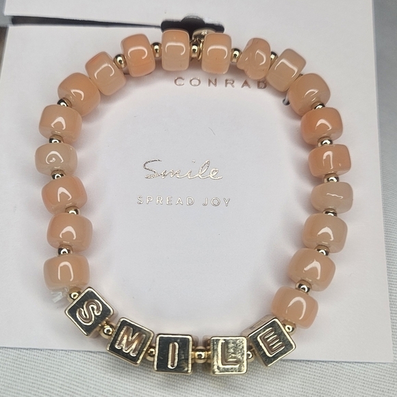 LC Lauren Conrad Jewelry - Lauren Conrad Gold Tone Metal And Peach Glass Bead Stretch Smile Bracelet